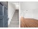 Open living space with stairs, wood floors, and neutral paint for versatile decorating at 382 Northdale Ct, Lawrenceville, GA 30046