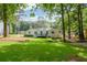 Spacious backyard featuring a well-maintained lawn and a deck, perfect for outdoor activities at 402 Princeton Way, Lawrenceville, GA 30044
