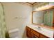 Traditional bathroom features a marble countertop, wood vanity, and floral wallpaper accents at 402 Princeton Way, Lawrenceville, GA 30044