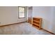 Neutral bedroom featuring carpet, a window, closet, and wooden bookshelf with wood trim at 402 Princeton Way, Lawrenceville, GA 30044