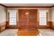 Elegant entryway showcasing wood floors, double doors, and decorative molding at 402 Princeton Way, Lawrenceville, GA 30044