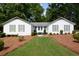 Charming single-story home with a well-manicured front lawn and inviting curb appeal at 402 Princeton Way, Lawrenceville, GA 30044