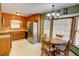 Cozy kitchen featuring wood cabinetry, stainless steel appliances, and a charming breakfast nook at 402 Princeton Way, Lawrenceville, GA 30044