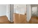 Hallway leading to a room, showcasing an open doorway and modern design with neutral color palette at 4095 Oriole Ln, Fairburn, GA 30213