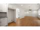 Kitchen features white cabinetry, granite counters, and a view of the adjacent hallway with a bathroom beyond at 4095 Oriole Ln, Fairburn, GA 30213