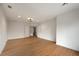 Spacious living room boasts hardwood floors, recessed lighting, and neutral paint at 4095 Oriole Ln, Fairburn, GA 30213