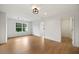 Living room with hardwood flooring, large window, recessed lighting, and white walls at 4095 Oriole Ln, Fairburn, GA 30213