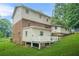Spacious backyard featuring a large deck and lush green lawn, perfect for outdoor entertaining at 574 Hickory Hills Ct, Stone Mountain, GA 30083