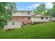 Spacious backyard featuring a large deck and lush green lawn, perfect for outdoor entertaining at 574 Hickory Hills Ct, Stone Mountain, GA 30083