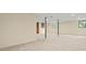 Spacious basement with neutral walls, carpeting, and support beams at 574 Hickory Hills Ct, Stone Mountain, GA 30083