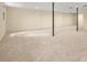 Finished basement offers flexible space with carpeting, and support beams at 574 Hickory Hills Ct, Stone Mountain, GA 30083