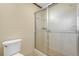 Bathroom with toilet and sliding glass door shower enclosure at 574 Hickory Hills Ct, Stone Mountain, GA 30083