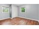 This bedroom features wood floors, blue walls, and a double-door closet at 574 Hickory Hills Ct, Stone Mountain, GA 30083