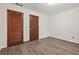 Bedroom featuring new floors, fresh paint, and two closets at 574 Hickory Hills Ct, Stone Mountain, GA 30083