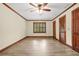 Bedroom featuring refinished trim, new floors, fresh paint, and large closet at 574 Hickory Hills Ct, Stone Mountain, GA 30083