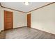 Bedroom featuring new floors, fresh paint, and two closets at 574 Hickory Hills Ct, Stone Mountain, GA 30083