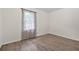 Bedroom featuring new floors, fresh paint, and large window at 574 Hickory Hills Ct, Stone Mountain, GA 30083