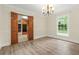 Bright dining room features new floors, fresh paint, and modern light fixture, with easy kitchen access at 574 Hickory Hills Ct, Stone Mountain, GA 30083