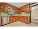 An updated kitchen featuring stainless steel appliances, light countertops and wooden cabinetry at 574 Hickory Hills Ct, Stone Mountain, GA 30083