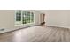 Bright living room with hardwood floors and large window providing natural light and scenic views at 574 Hickory Hills Ct, Stone Mountain, GA 30083