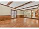 Bright open-plan living room featuring hardwood floors and view of the kitchen at 574 Hickory Hills Ct, Stone Mountain, GA 30083