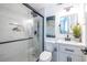 Modern bathroom with glass shower, marble tile, and stylish black fixtures at 115 Biscayne Nw Dr # F10, Atlanta, GA 30309