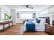 Bright bedroom with hardwood floors, and a comfortable bed with stylish blue accents at 115 Biscayne Nw Dr # F10, Atlanta, GA 30309