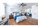 Bright bedroom features a ceiling fan and a mirrored closet for ample storage at 115 Biscayne Nw Dr # F10, Atlanta, GA 30309