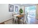 Dining area features a modern table set, backyard access, and bright natural light at 115 Biscayne Nw Dr # F10, Atlanta, GA 30309