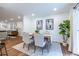 Bright dining area offers neutral walls, hardwood floors, and flows into the living room at 115 Biscayne Nw Dr # F10, Atlanta, GA 30309