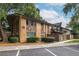 View of the building showing brick and stone, with nearby parking and attractive landscaping at 115 Biscayne Nw Dr # F10, Atlanta, GA 30309