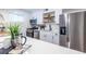 Bright kitchen features stainless steel appliances, white cabinets, and quartz countertops at 115 Biscayne Nw Dr # F10, Atlanta, GA 30309
