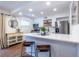 Bright kitchen features stainless appliances, white cabinets, and a breakfast bar at 115 Biscayne Nw Dr # F10, Atlanta, GA 30309