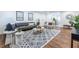 Inviting living room with hardwood floors, modern furniture, decorative accents, and an open layout at 115 Biscayne Nw Dr # F10, Atlanta, GA 30309