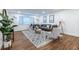 Inviting living room featuring hardwood floors, a decorative rug, and modern furnishings at 115 Biscayne Nw Dr # F10, Atlanta, GA 30309