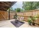 Cozy fenced in patio with neutral decor and outdoor seating at 115 Biscayne Nw Dr # F10, Atlanta, GA 30309