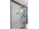 Elegant shower with frameless glass door, rainfall showerhead, and tiled niche at 115 Biscayne Nw Dr # F10, Atlanta, GA 30309
