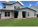 Spacious backyard with green lawn, complete with covered patio and fenced perimeter at 2159 Holland Creek Ln, Buford, GA 30519