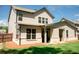 Rear exterior view of a home highlighting the back porch and adjacent green lawn at 2159 Holland Creek Ln, Buford, GA 30519