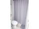 Clean bathroom featuring a patterned shower curtain at 2159 Holland Creek Ln, Buford, GA 30519