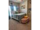 Bedroom featuring carpet, a bed with teal accents, and natural light at 2159 Holland Creek Ln, Buford, GA 30519