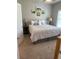 Bedroom featuring carpet and a bed with a white comforter near a window at 2159 Holland Creek Ln, Buford, GA 30519