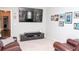 Bonus room with wall-mounted TV and leather seating at 2159 Holland Creek Ln, Buford, GA 30519