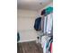 Walk-in closet with wire shelving and dark wood floors at 2159 Holland Creek Ln, Buford, GA 30519
