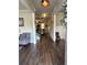Inviting foyer with wood flooring, a staircase, and views into the open living spaces at 2159 Holland Creek Ln, Buford, GA 30519