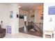 View of the hallway with wood floors, decorated walls, a wooden staircase, and decorative lighting at 2159 Holland Creek Ln, Buford, GA 30519