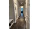 Bright hallway with storage and access to the laundry room and other interior spaces at 2159 Holland Creek Ln, Buford, GA 30519