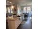Modern kitchen with a large island, granite countertops, and stainless steel appliances at 2159 Holland Creek Ln, Buford, GA 30519