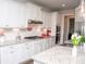 Modern kitchen with white cabinets, granite countertops, and stainless steel appliances at 2159 Holland Creek Ln, Buford, GA 30519
