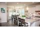 Bright, spacious kitchen featuring an island with bar seating and a dining area at 2159 Holland Creek Ln, Buford, GA 30519